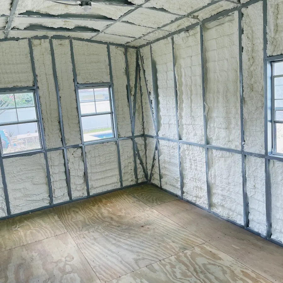 Closed-cell spray foam insulation applied to wall cavities in a residential project in Tewksbury